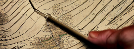 dowsing rod on ancient map